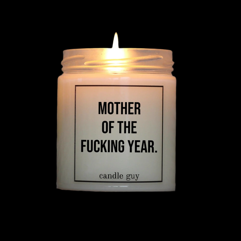 Candle Guy scented candle in a glass
